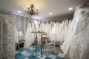 The bridal department at the St Richard's Hospice shop in Mealcheapen Street Worcester. Lots of white brides dresses are displayed on rails lining every wall. 