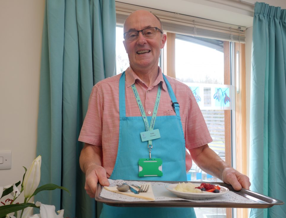 Colin Rowley serving food