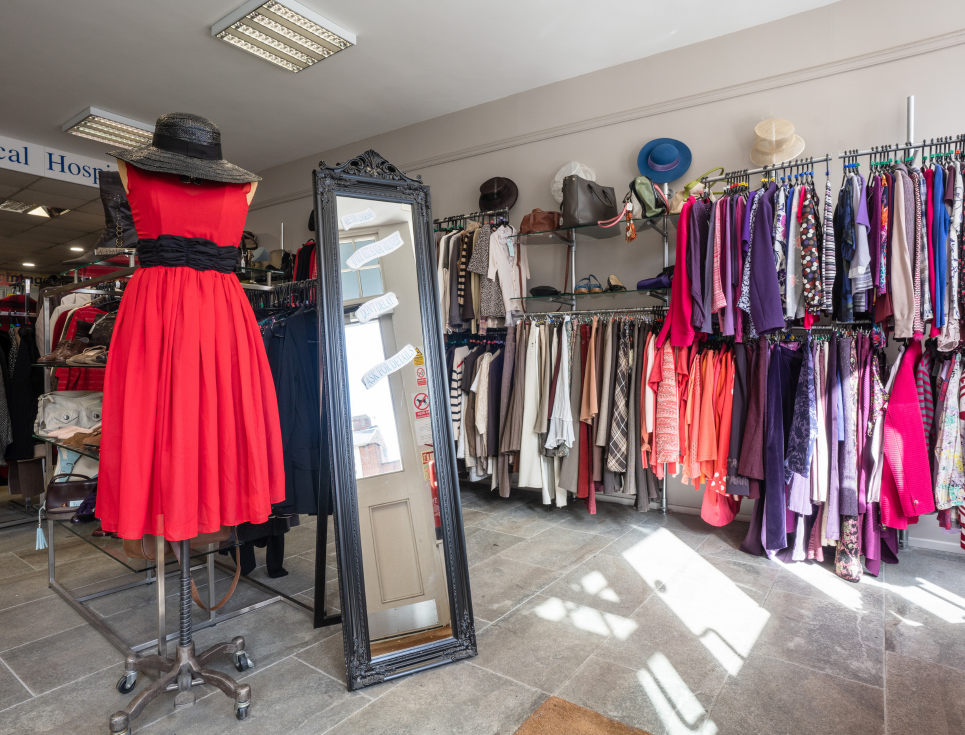 This button takes you to a page about our quality donation campaign. The image shows a shop mannequin wearing a red dress.