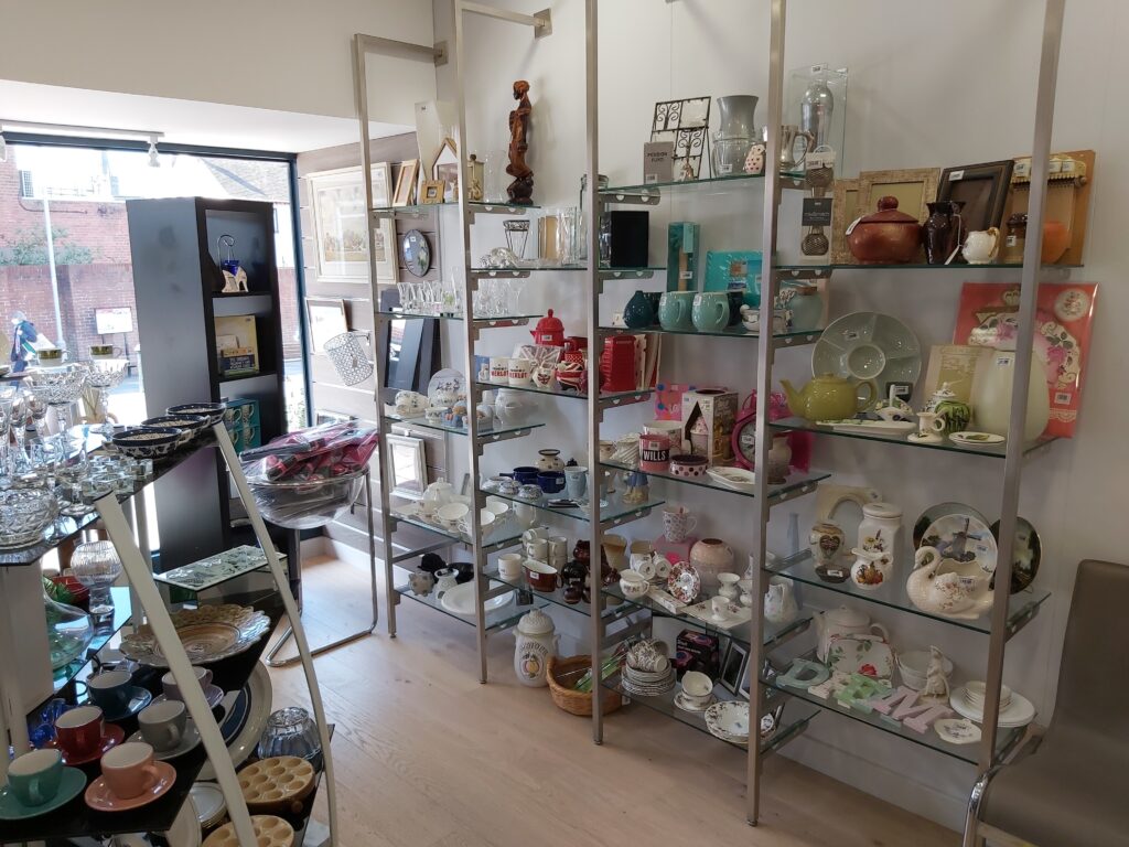 The inside of the St Richard's Hospice shop in Bromsgrove. There are shelves of bric-a-brac on display.
