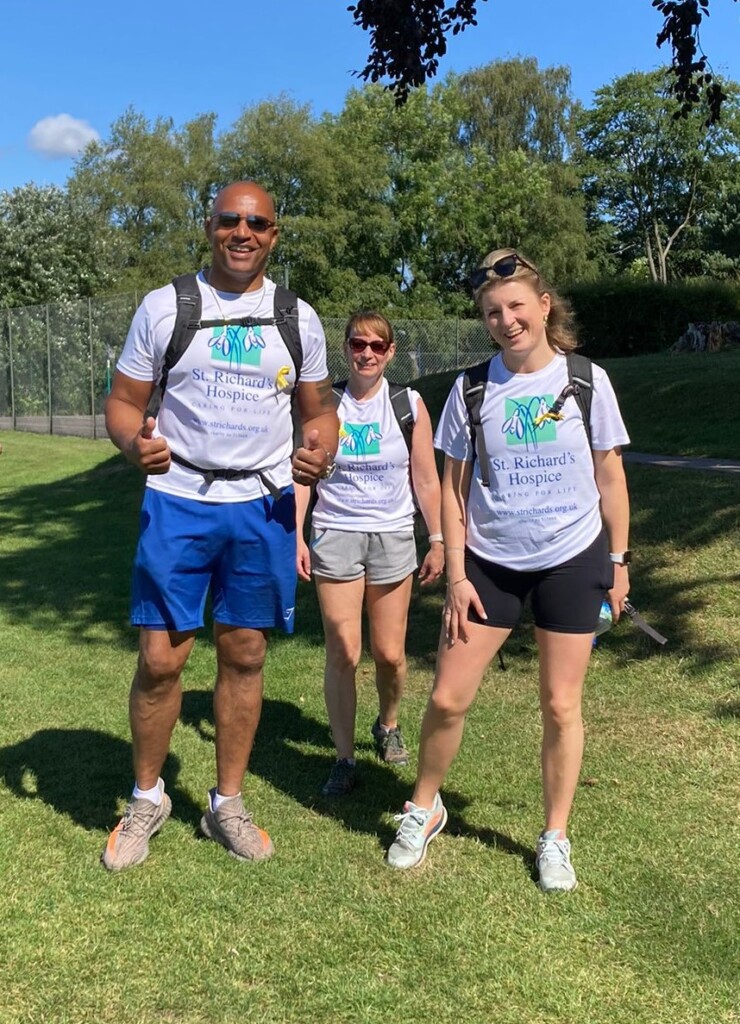 Three walkers in hospice t shirts