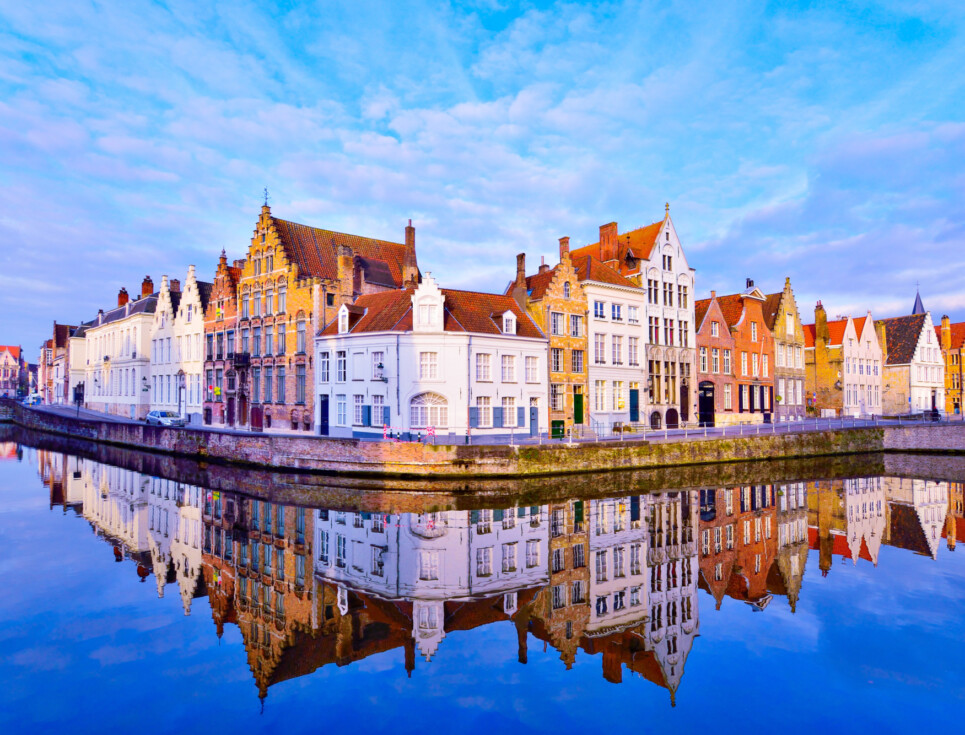 Brugge architecture reflecting onto water.