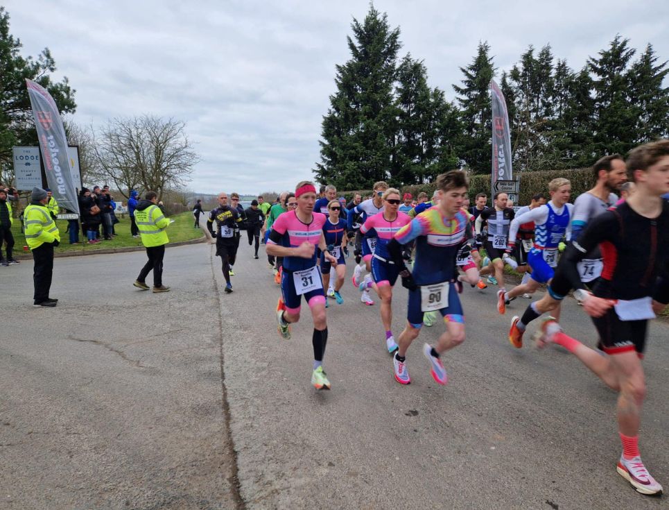 A group of runners, running in a duathlon.