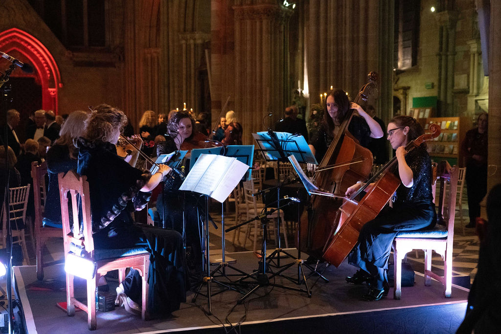 Toscana Strings play at the Grand Gala Dinner. They are a group playing string instruments.