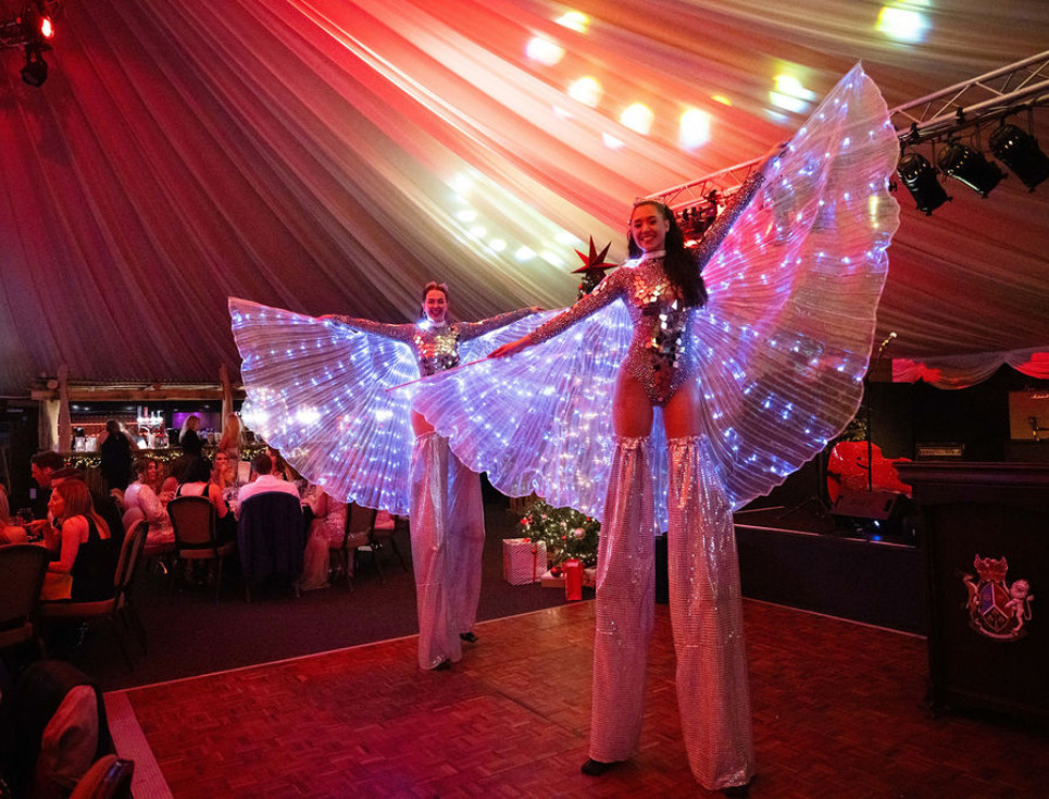 Stilt walkers at the 2025 Snowdrop Ball